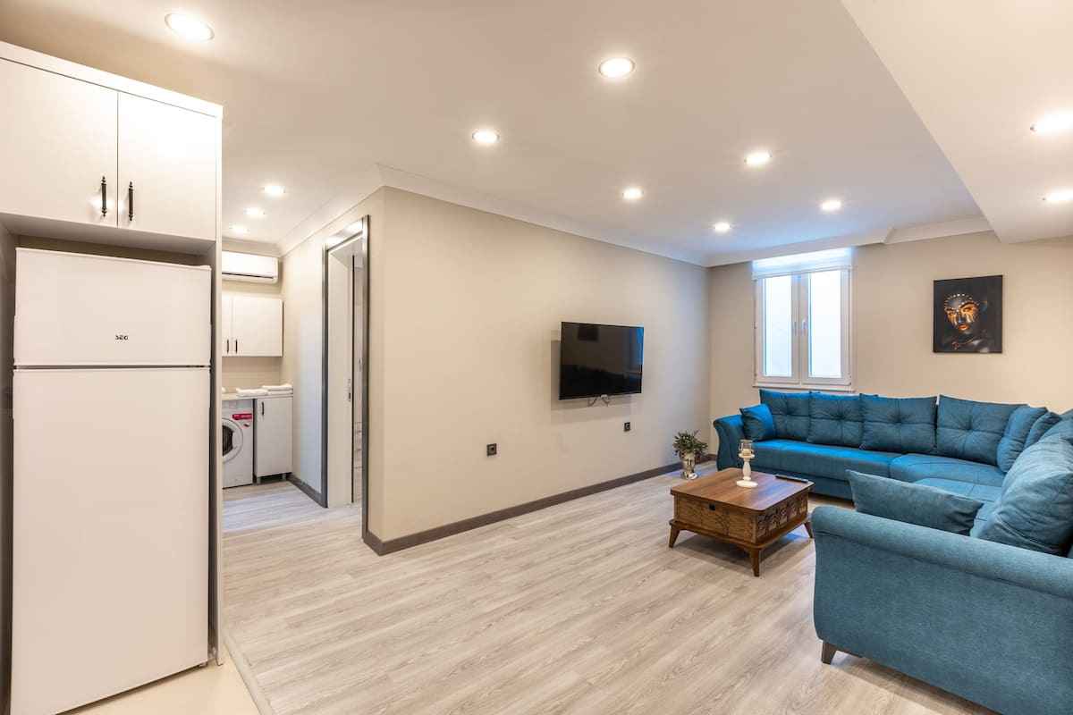 basic apartment, no windows | desk, laptop workspace, blackout curtains, soundproofing