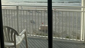 A balcony with a view of the beach and ocean. - Oceanfront Efficiency T508 (Myrtle Beach)