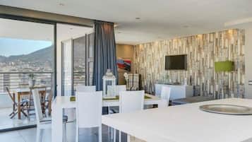 Two Bedroom Platinum Apartment | Living area | 74-inch flat-screen TV with satellite channels, TV, Netflix