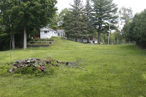 Surrounded by lush trees, this serene setting offers a peaceful retreat.