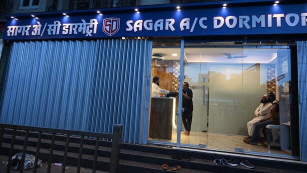 A dormitory named 'Sagar A/C Dormitory' with a visible entrance and a person standing outside. - Sagar Dormitory Andheri - Nearest to Andheri Railway Station West (Mumbai)
