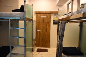 A bunk bed room with a wooden door labeled 'WASHROOM'. - Sagar Dormitory Andheri - Nearest to Andheri Railway Station West (Mumbai)
