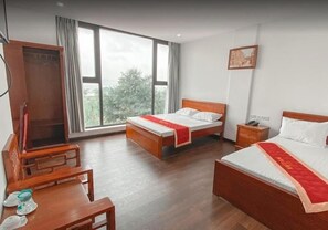 Premium bedding, desk, laptop workspace, blackout curtains