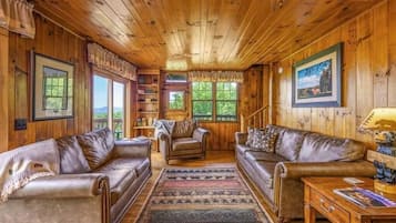 Cabana, vários quartos | Área de estar