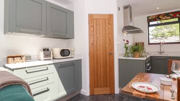 Fridge, electric kettle, toaster, cookware/dishes/utensils