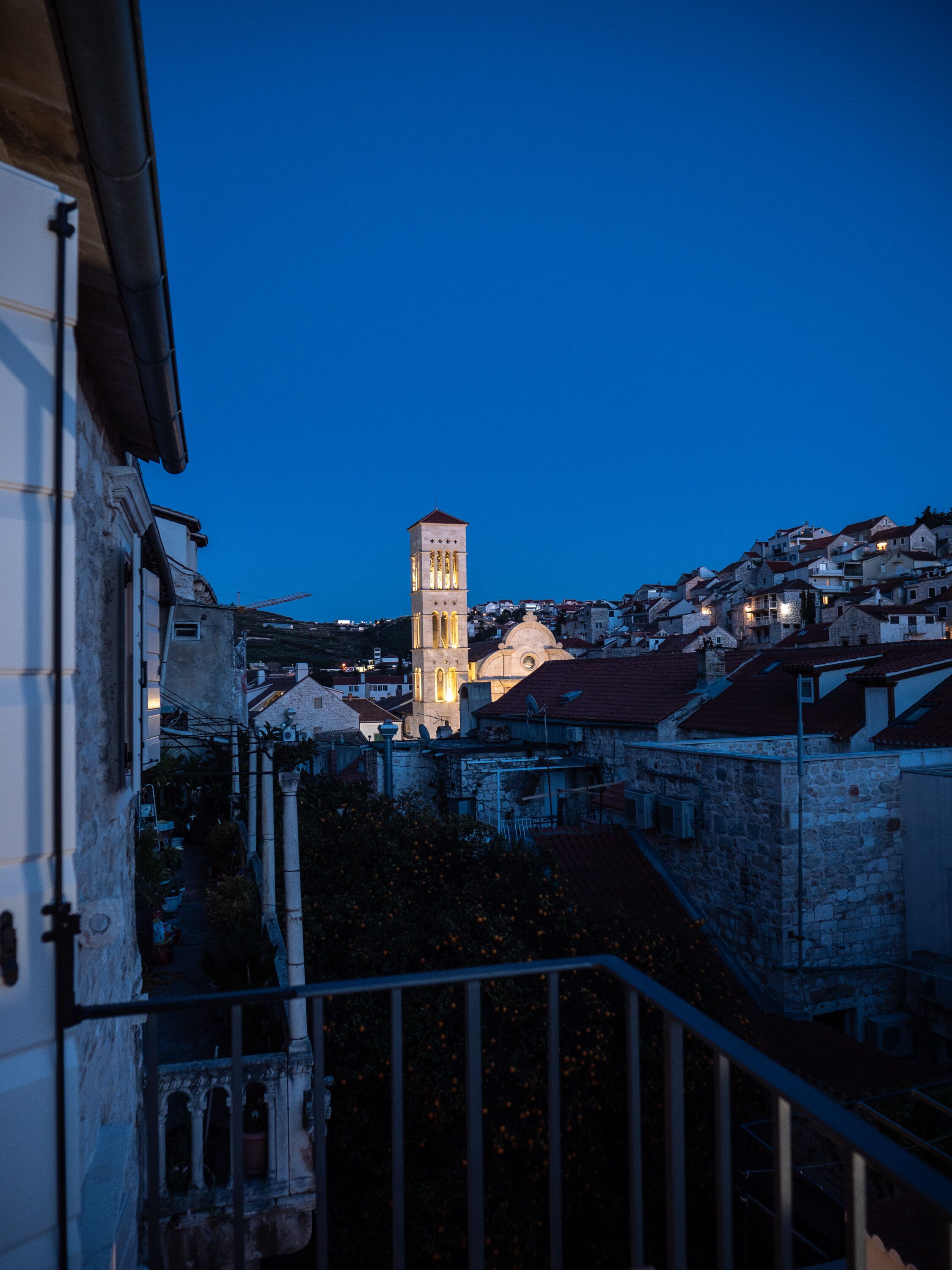 A historic town with a prominent tower and stone buildings.
