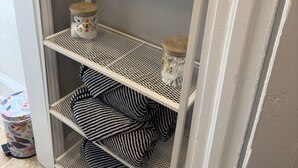 A white metal shelf unit with a sign that reads "Wash Your Hands" above it. - {Sunflower Morning} A cozy farmhouse-style house in South End HOT TUB! (Charlotte)