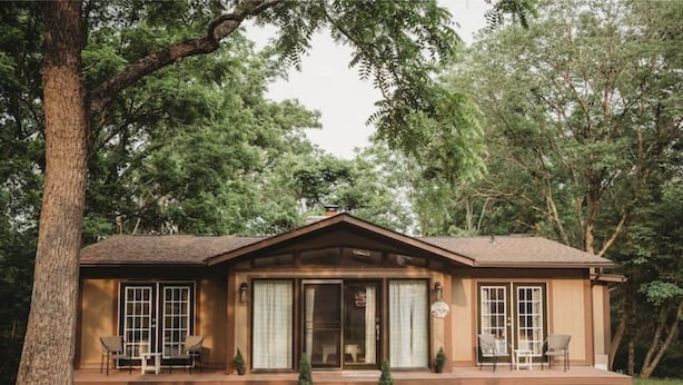 A wooden cabin with a porch, large windows, and a small front yard. - Cottage near water park, golf and skiing at Massanutten Resort! (McGaheysville)