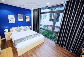Habitación doble Deluxe, 1 cama Queen size, baño privado | Ropa de cama hipoalergénica, camas con efecto memoria y minibar 