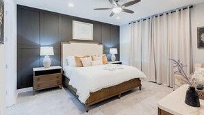 A bedroom with a bed, nightstands, a ceiling fan, and a window with curtains. - Magical 6BR PetFriendly @Encore Near Disney 7722 (Kissimmee)
