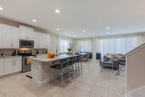 Enjoy a comfortable stay in this stylish apartment with a central kitchen, dining area, and cozy living space.