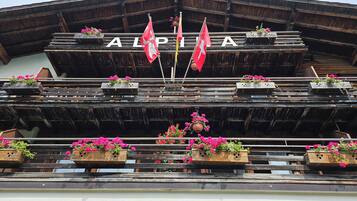 A building with the name "ALPIA" displayed prominently.