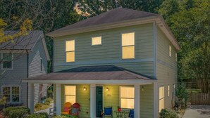 A two-story house with a front porch, a door number 1723, and a small garden area. - 3-BR Getaway Near Center City/Plaza Midwood/NoDa! (Charlotte)