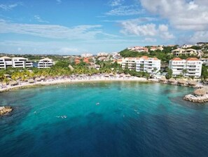 Enjoy breathtaking views of the turquoise bay from the resort's elevated vantage point.