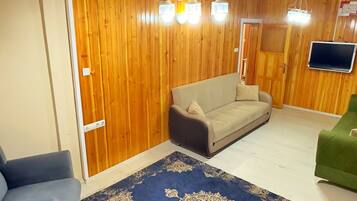 Comfort appartement | Woonruimte | Een flatscreentelevisie