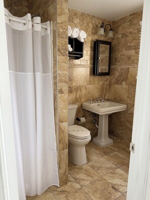 Shower, towels, soap, toilet paper