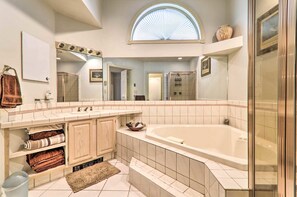 Jetted tub, hair dryer, towels, toilet paper