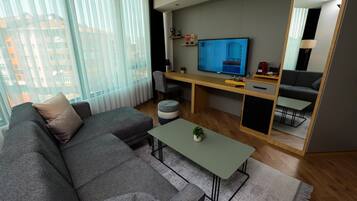 Business Suite | Living area | 155-cm LED TV with satellite channels, TV, Netflix