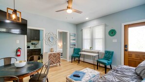 A modern living room with a dining area, a kitchen, and a bedroom. - Modern Ocean City Getaway: Walk to Boardwalk! (Ocean City)