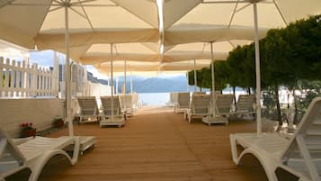 Private beach, beach umbrellas, beach bar