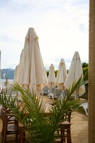 Private beach, beach umbrellas, beach bar