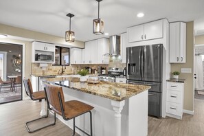 Fridge, microwave, oven, stovetop - Bright, Spacious 4BD Suburban Nest w/Garage & Yard, hosted by DenverStays (Arvada)