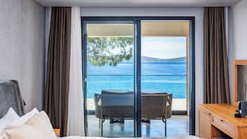Quarto superior, vista para o mar | Ferros/tábuas de passar roupa, Wi-Fi de cortesia, roupa de cama