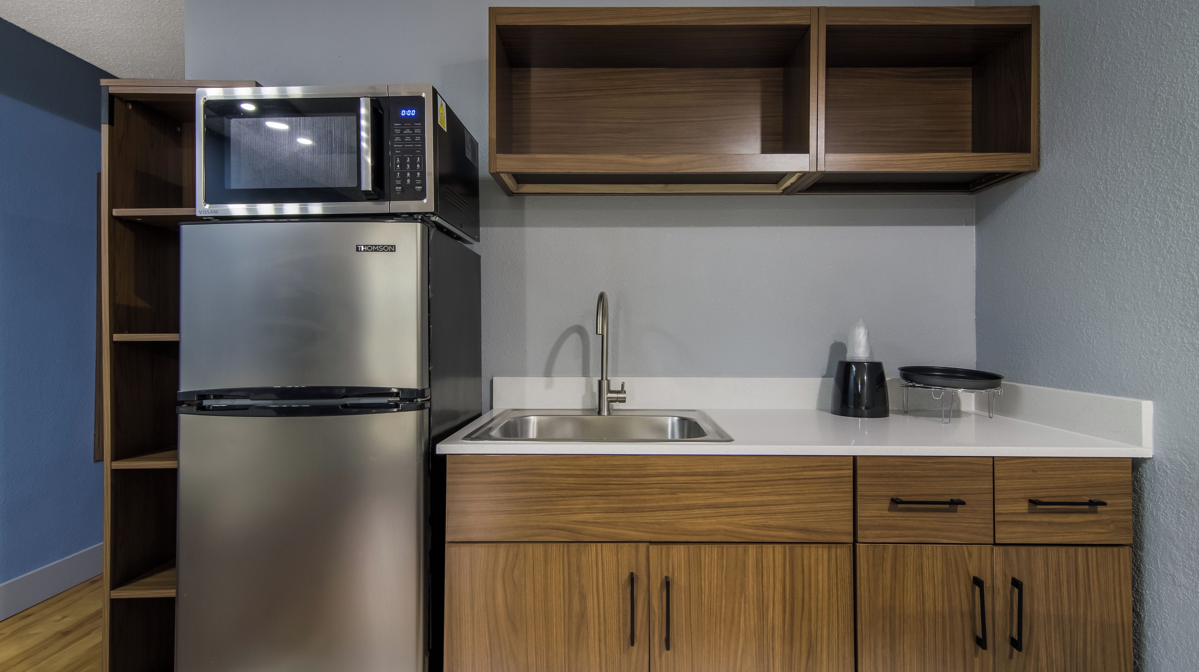 Full-size fridge, microwave, stovetop, freezer