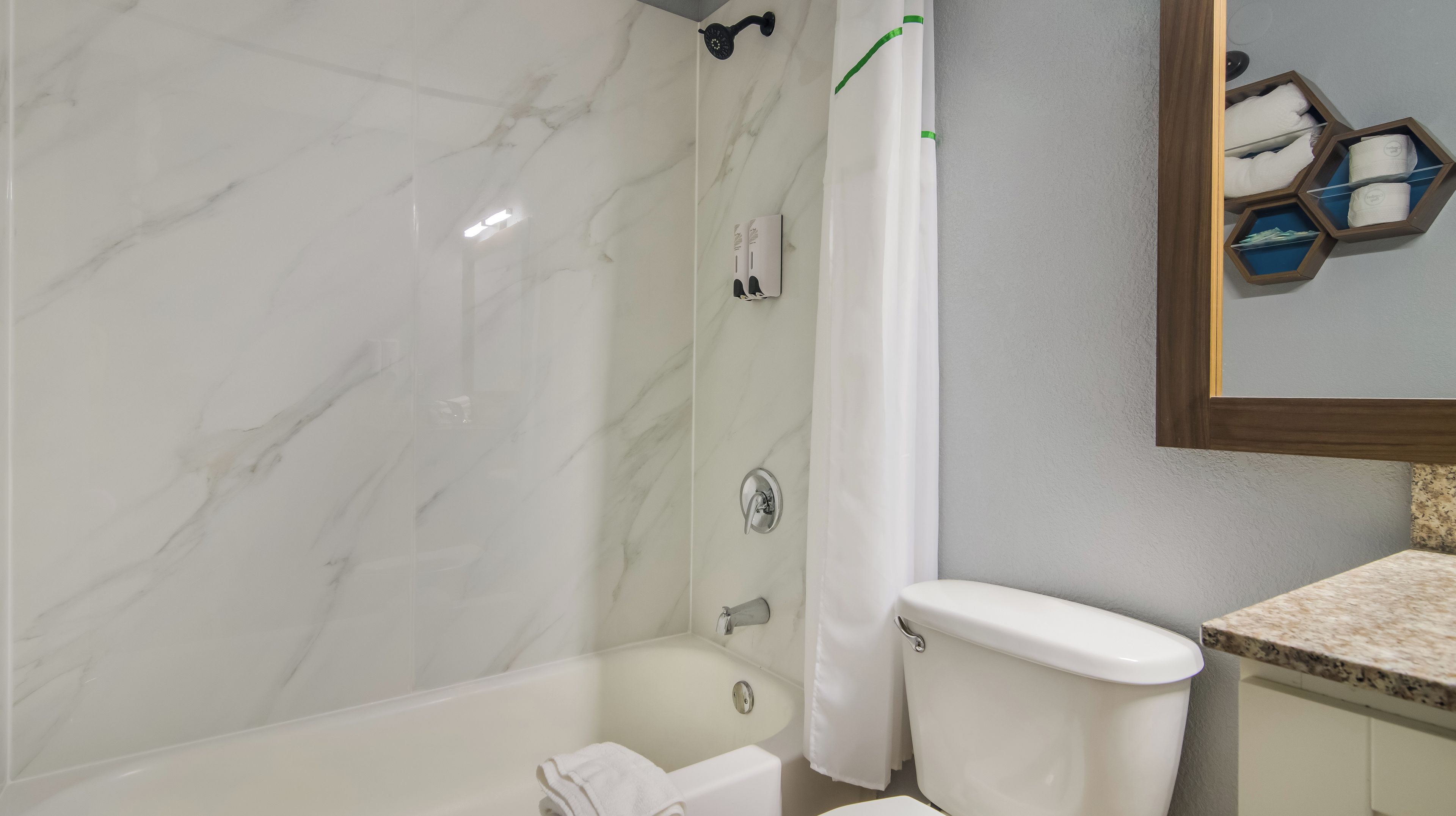 Combined shower/tub, towels, soap, shampoo