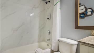 Combined shower/tub, towels, soap, shampoo