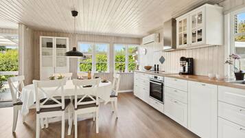 Fridge, stovetop, dishwasher, coffee/tea maker