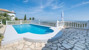 A swimming pool with a white deck and a white railing, surrounded by a stone patio. - Lovely home in El Rafol D'Almunia (El Rafol D'Almunia)