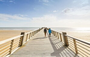 A wooden boardwalk leading to a beach with a clear sky. - Cozy home in St.Jean de Monts (Saint Jean de Monts)