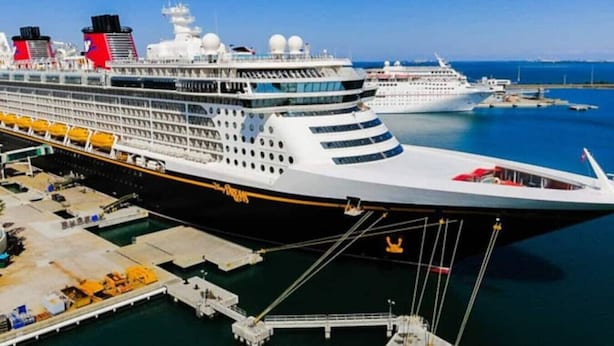 A large cruise ship docked at a port with multiple decks and lifeboats visible. - Pool 5BR/3BA Launchpad (Titusville)