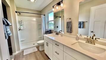 Shower, hair dryer, towels, soap