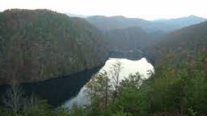 A valley with a lake surrounded by forested hills. - Three-Bedroom Bungalow.... (Robbinsville)