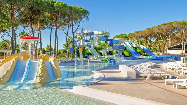 A water park with multiple slides and a pool area with lounge chairs. - 3 bedroom beautiful (sta)caravan in Sete (Sete)