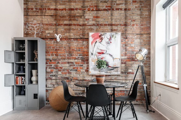 Discover urban elegance in our SoHo Loft's living area, bathed in natural light and enriched with art from around the globe. A stone's throw from Stratford's Avon Theatre and vibrant dining scene, it's an urban creative's dream