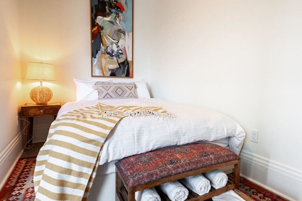 Luxurious bedroom featuring a Queen bed with bohemian elegance, promising restful nights after exploring Stratford’s historical downtown and Avon River. Close to the Stratford Festival, it's a haven of comfort and style