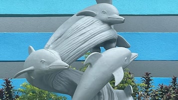 A sculpture of dolphins in a fountain.