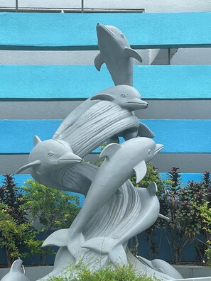 A sculpture of dolphins in a fountain.