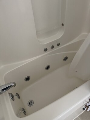 Jetted bath, hair dryer, towels, soap