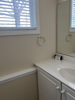 Jetted bath, hair dryer, towels, soap