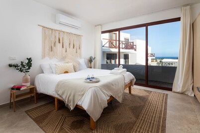 Ocean Views from every room! Modern Condo near the beach. No cleaning Fees!