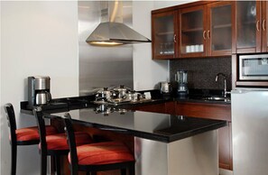 Fridge, microwave, stovetop, coffee/tea maker