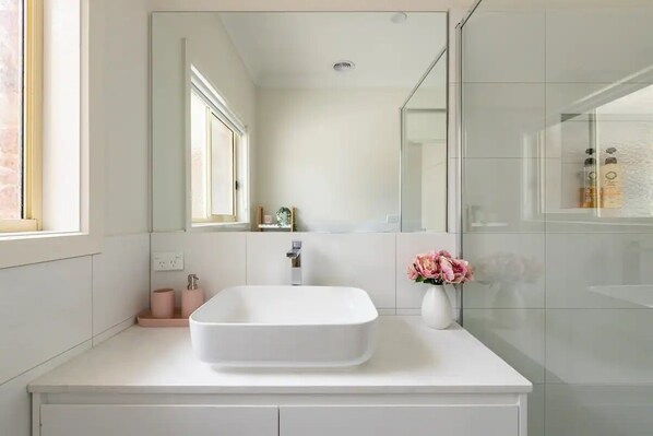 Shower, hair dryer, towels, soap