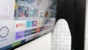 A computer screen displaying a streaming service interface with various content categories.
