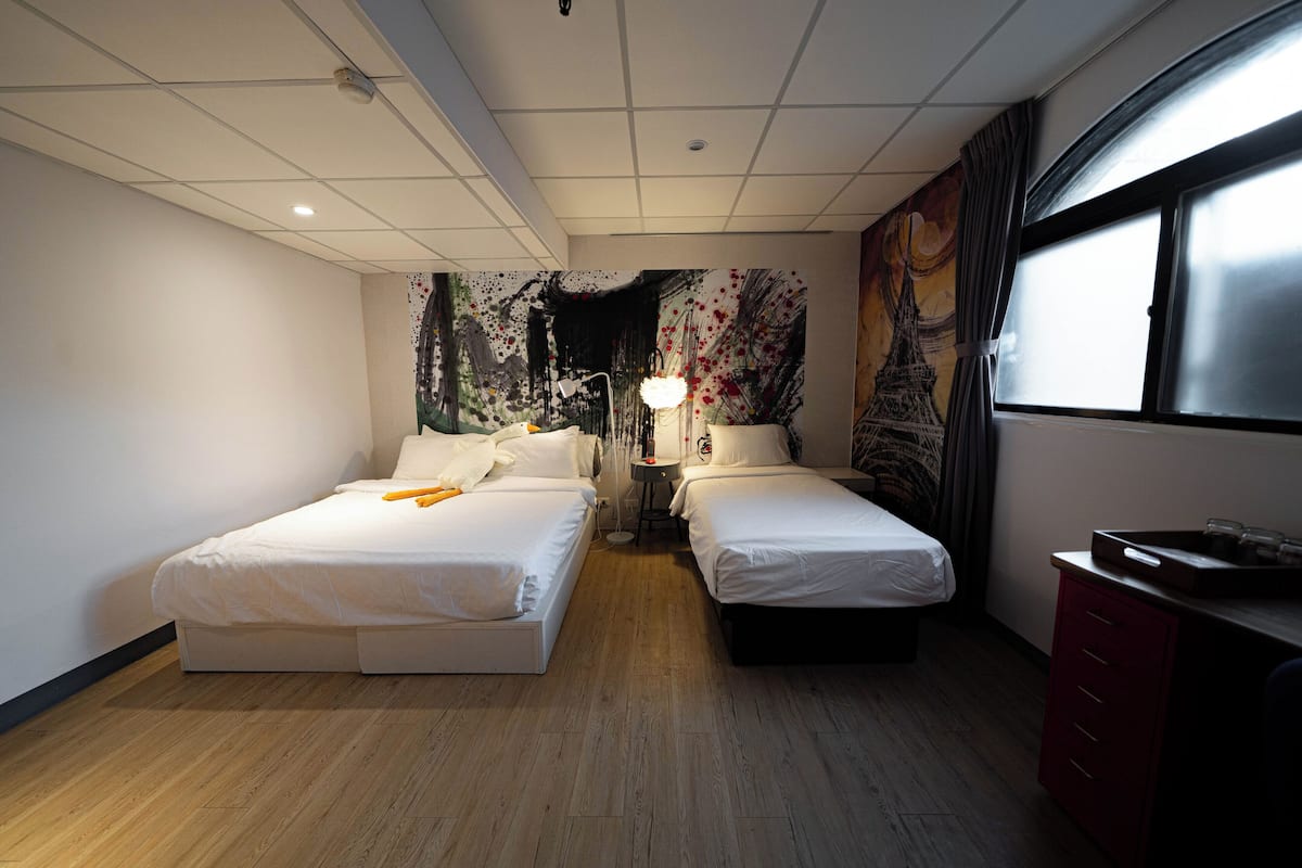 Deluxe Triple Room, 1 Bedroom | 1 bedroom, down comforters, individually decorated, desk