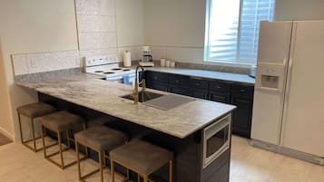 Kitchen island with four bar stools