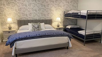 Bedroom with a queen bed and a twin-over-twin bunk bed